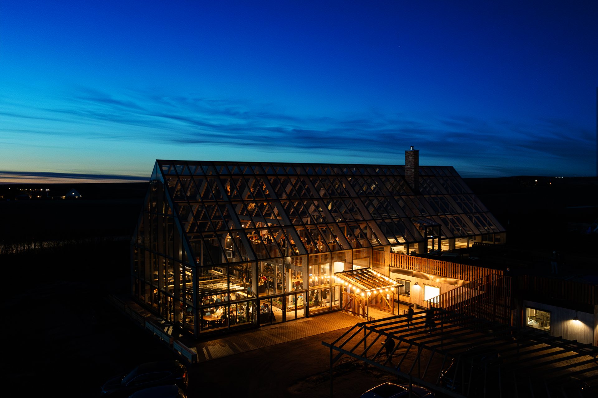 Stenmarks' greenhouse glowing at dusk